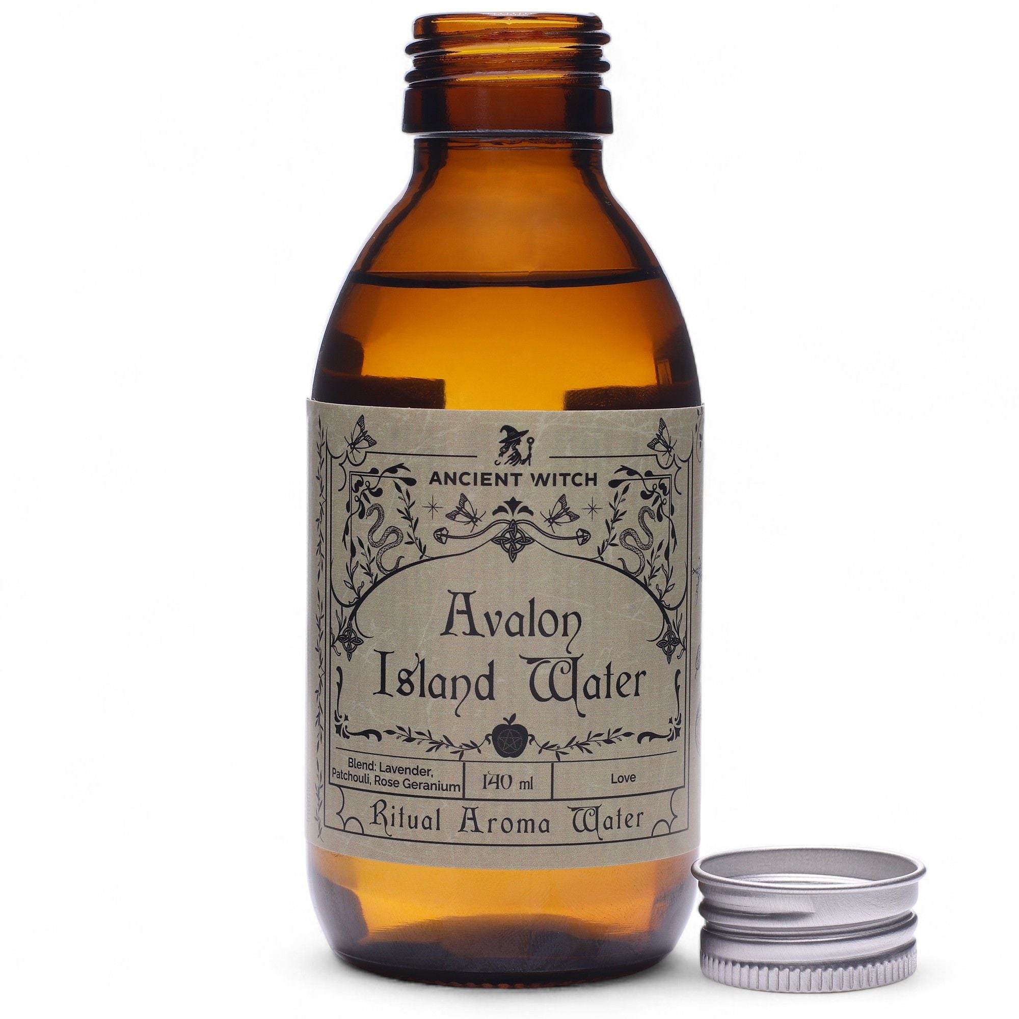 Eau rituelle île avalon en flacon ambré avec bouchon posé à côté, utilisée pour les rituels énergétiques et la revitalisation