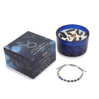Bougie astrologique taureau avec cristaux et bracelet en pierres naturelles présentés en coffret cadeau