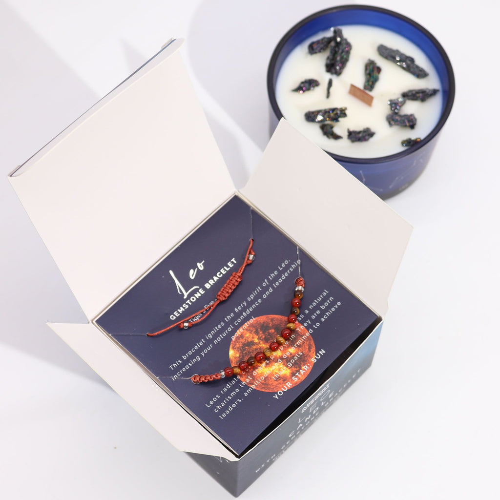 Boîte lion ouverte contenant bracelet en pierres naturelles et bougie parfumée aux cristaux pour rituel bien-être