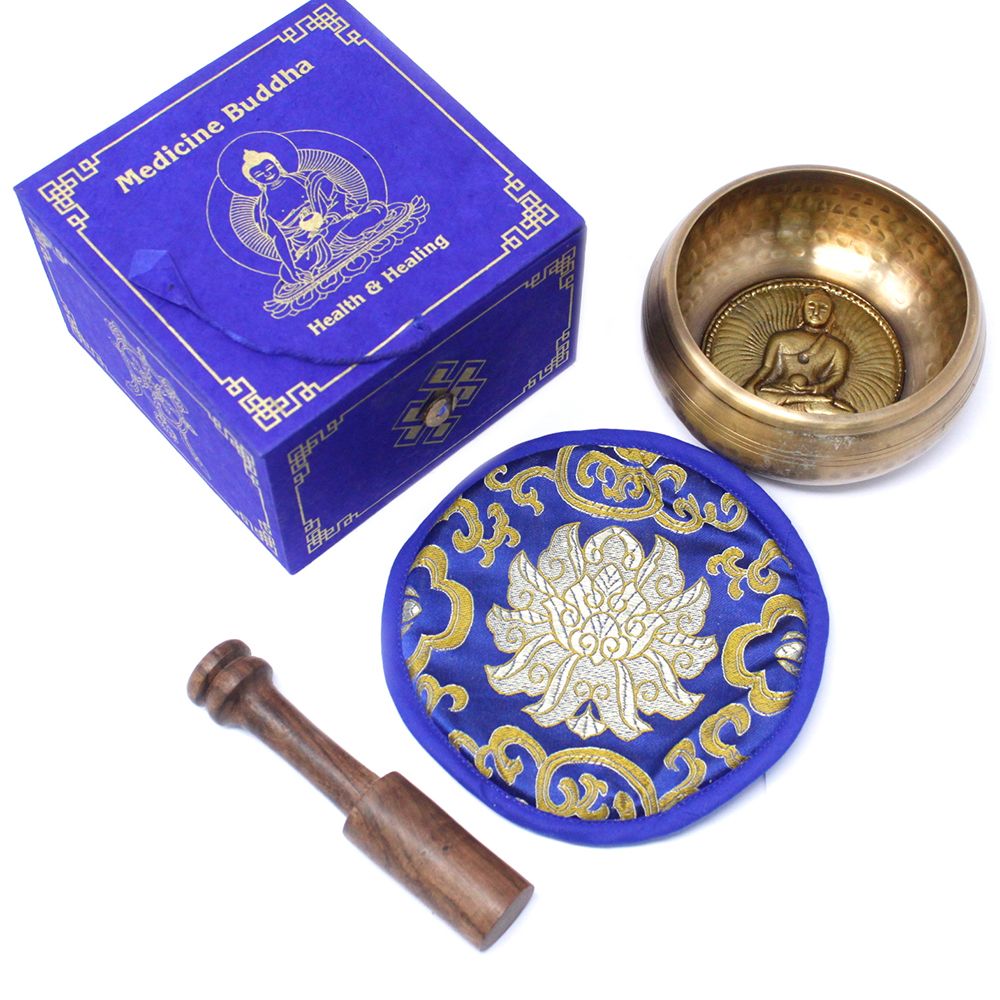 Bol chantant tibétain avec gravure Bouddha medicine, coussin bleu décoratif et maillet en bois