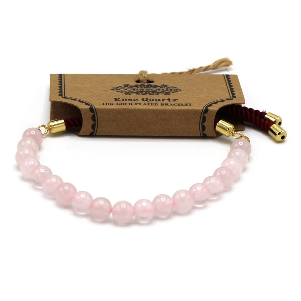 Bracelet quartz rose sur fond blanc avec packaging en carton