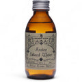 Flacon en verre ambré de l’eau rituelle île d'avalin avec étiquette vintage, inspirée des rituels de purification et de vitalité