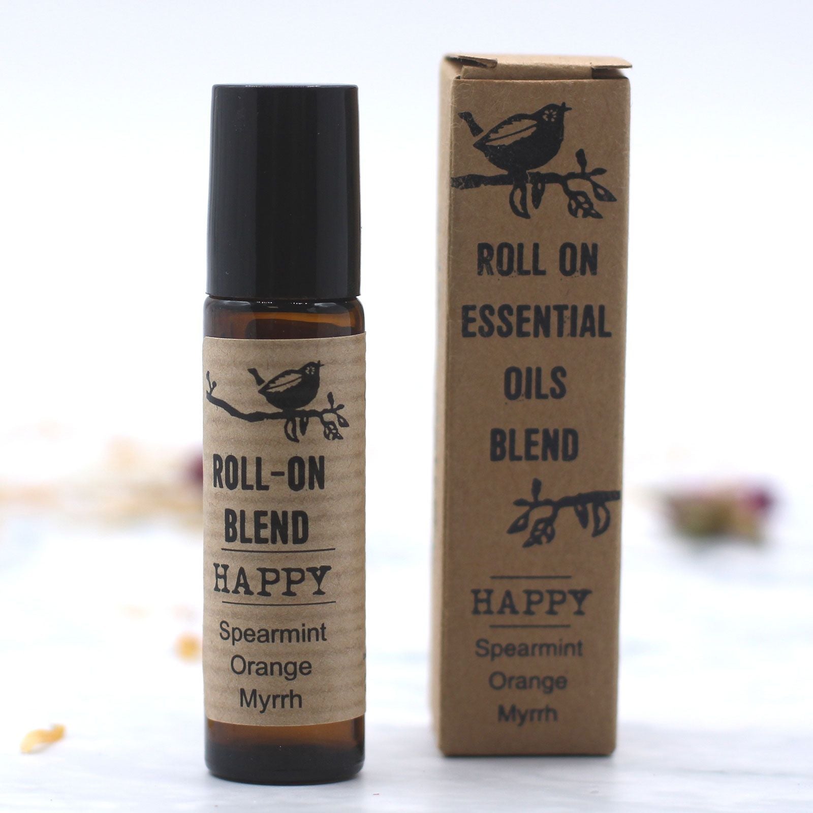Flacon roll-on huiles essentielles Happy 10 ml et packaging naturel pour rituel de bien-être et relaxation